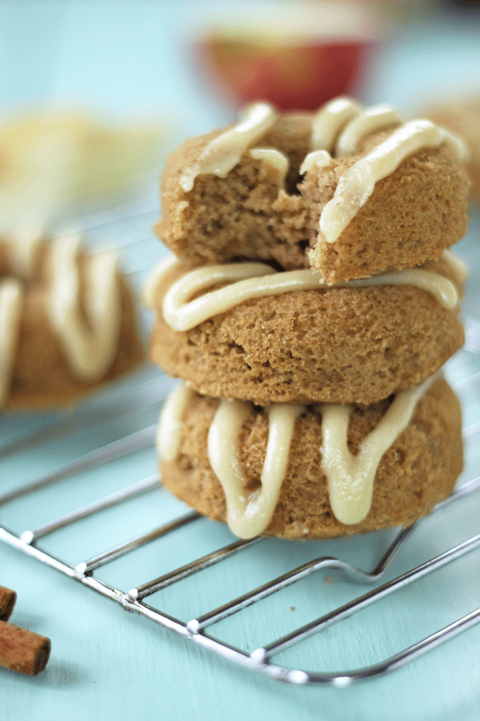 Healthy gluten free apple cake donuts with a creamy maple glaze.