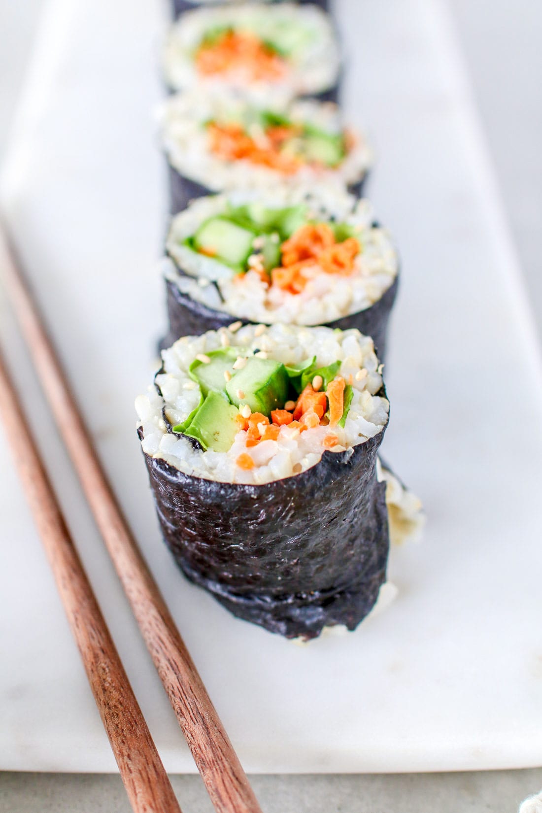 These healthy brown rice sushi rolls are stuffed with colourful veggies all wrapped up in toasted seaweed. 