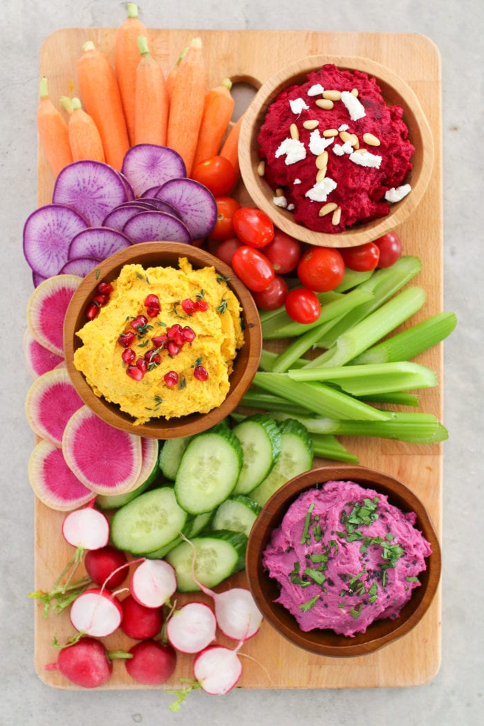 Vibrant veggie based hummus three ways to serve with your favourite crackers, chips and fresh veggies - perfect for any party or get together!