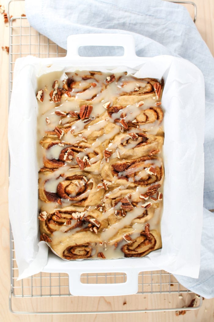 These warm, gooey, soft, homemade cinnamon rolls drizzled in the most delicious refined sugar-free glaze are the perfect treat for breakfast and dessert this holiday season!