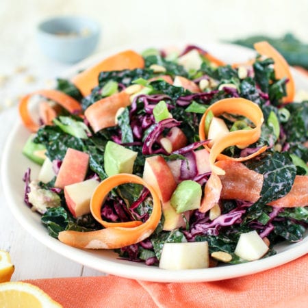 This seriously delicious winter detox salad made with crunchy kale, red cabbage and crispy apples, topped with a zingy lemony ginger dressing is the only salad you will want to eat this winter.