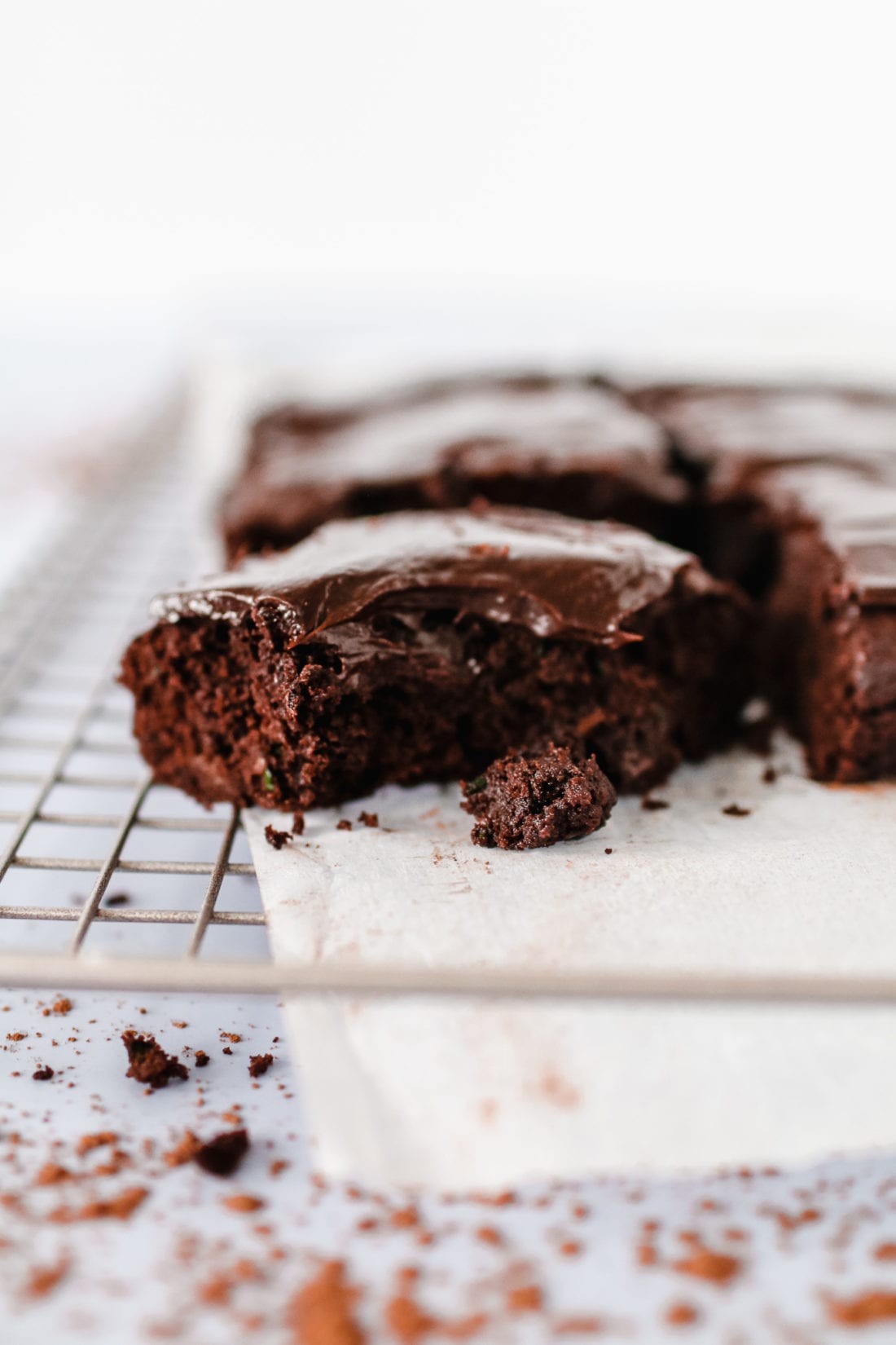This gluten-free triple chocolate zucchini brownie slathered in chocolate avocado frosting is the ultimate decadent dessert but with a healthy twist. 