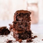 This gluten-free triple chocolate zucchini brownie slathered in chocolate avocado frosting is the ultimate decadent dessert but with a healthy twist.