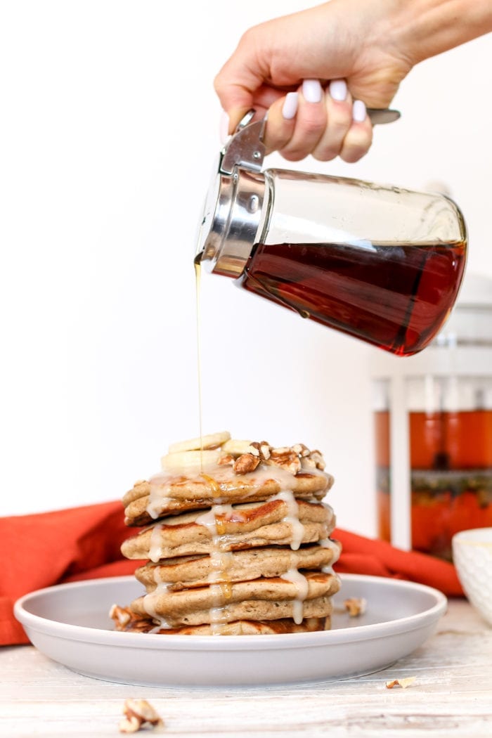 These simple and delicious, fluffy pancakes infused with warming chai spices and drizzled with a maple coconut butter glaze makes for a perfect cozy breakfast on a Sunday morning.