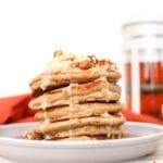 These simple and delicious, fluffy pancakes infused with warming chai spices and drizzled with a maple coconut butter glaze makes for a perfect cozy breakfast on a Sunday morning.