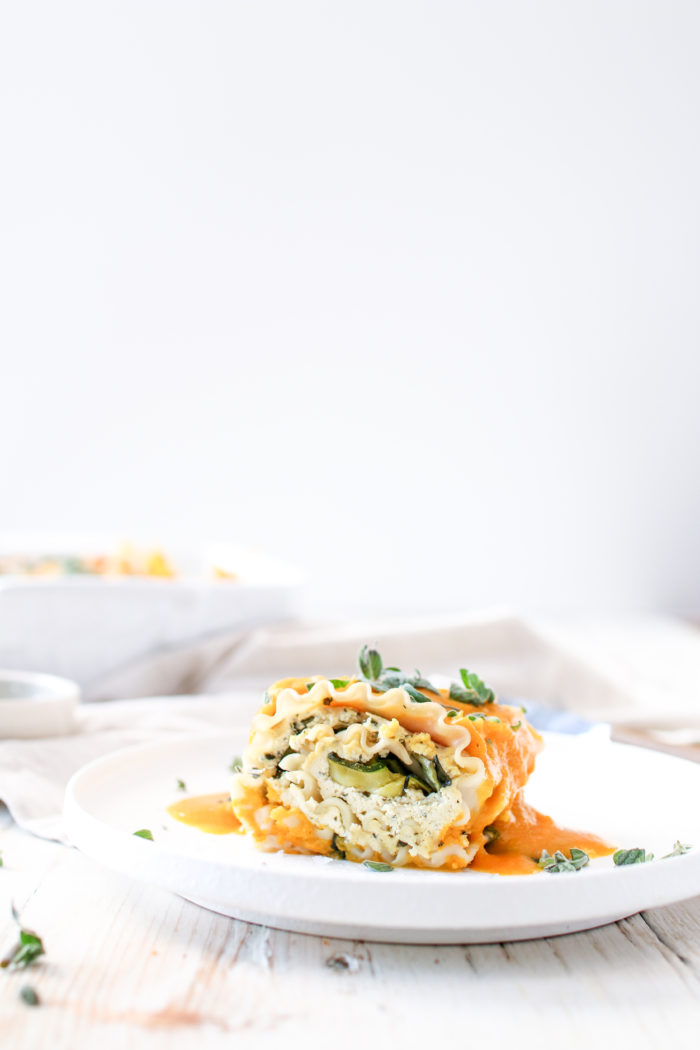 These delicious and tasty Butternut Squash and Spinach Lasagna Roll Ups are stuffed with “ricotta”, spinach, zucchini and drowning in butternut squash purée. Perfect for any night of the week!