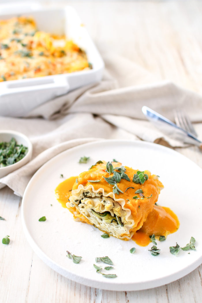 Butternut Squash and Spinach Lasagna Roll Ups served on a white plate